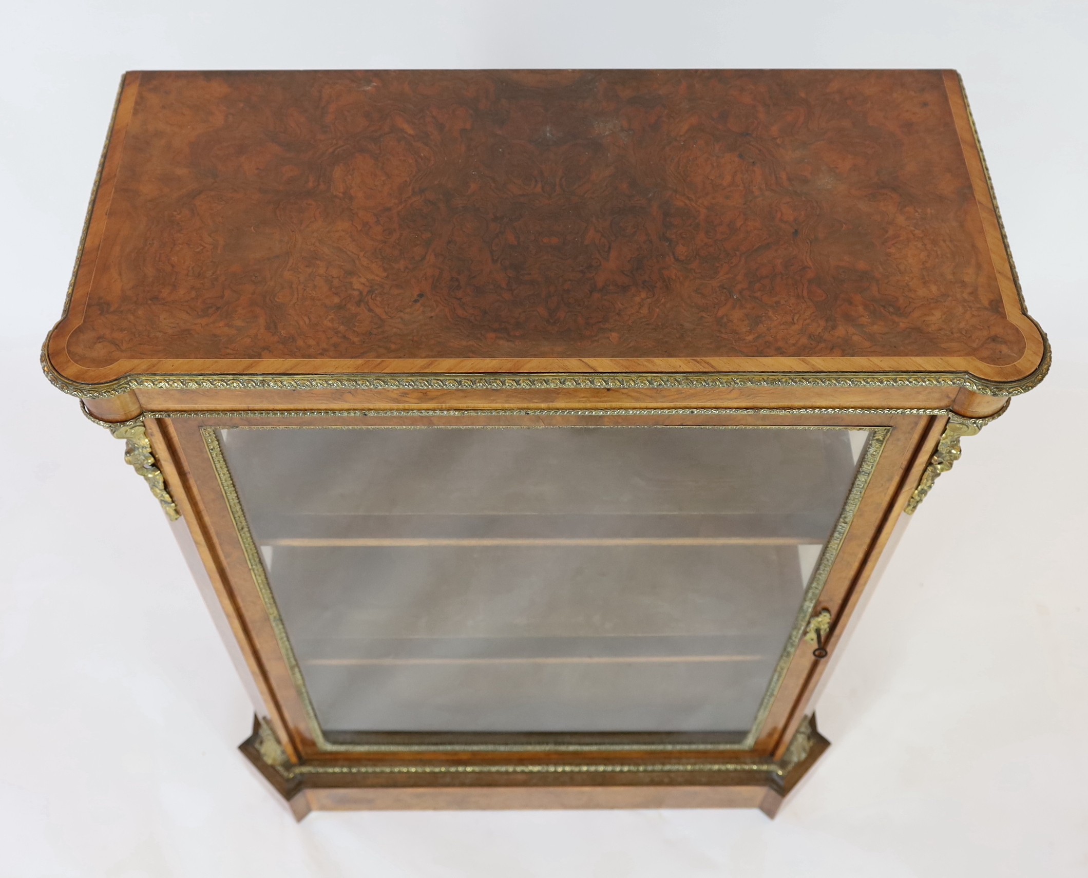 A 19th century French ormolu mounted figured walnut pier cabinet, width 90cm depth 40cm height 114cm